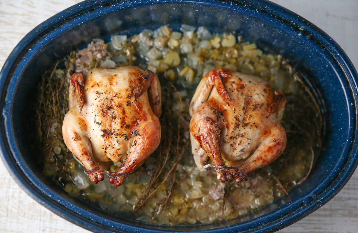 Cornish game hens in a roasting pan