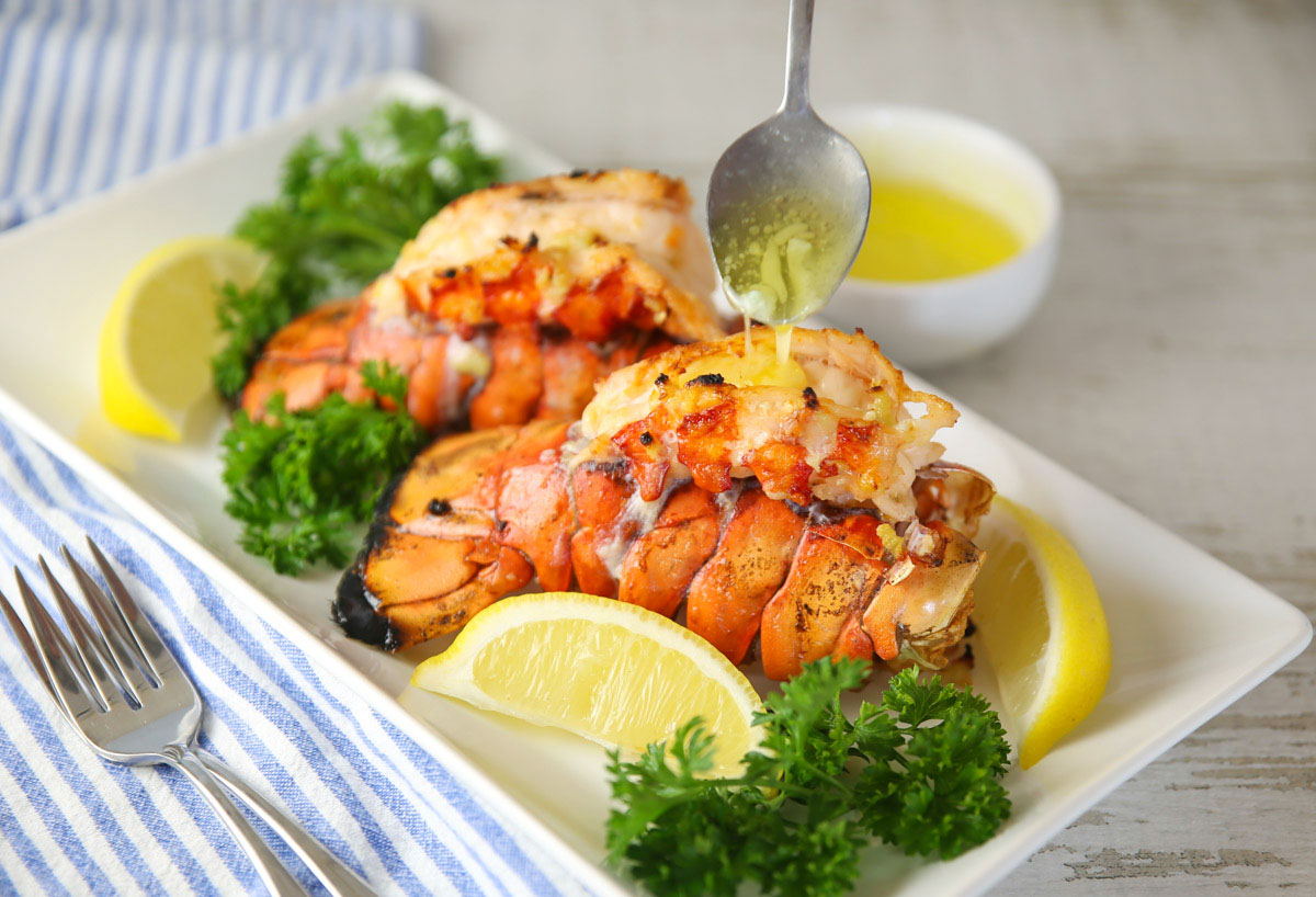 pouring butter on lobster tail