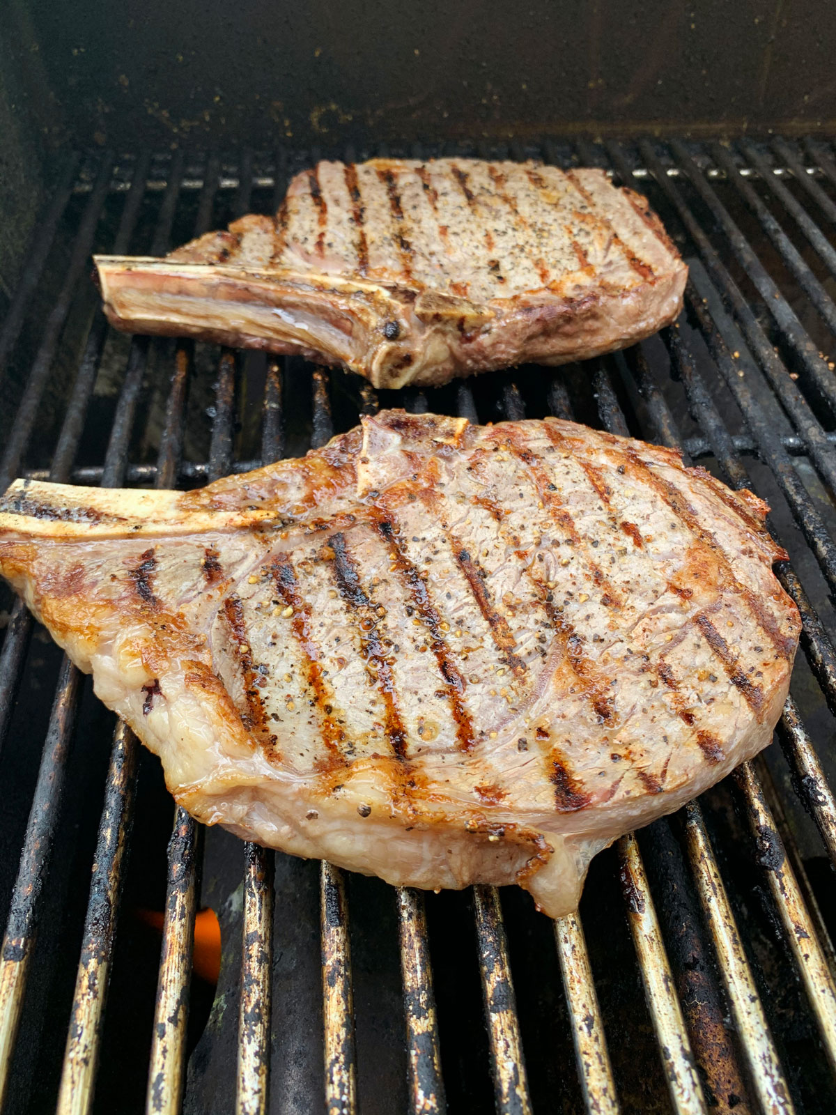 ribeye steak cooking on the grill