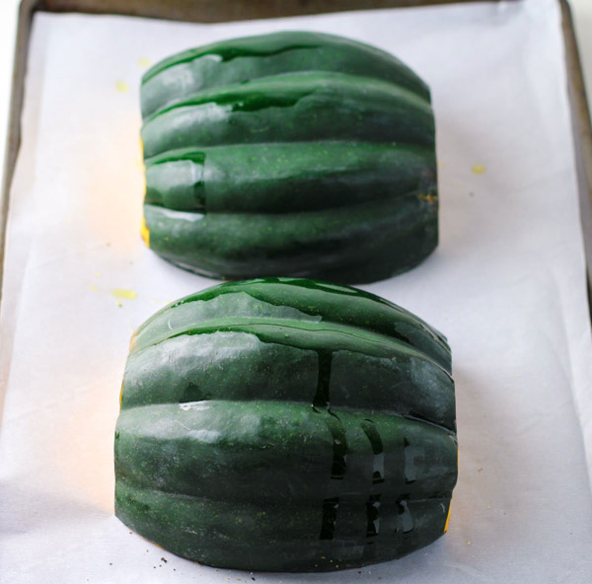 acorn squash inside down on sheet pan