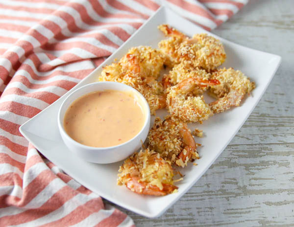 gluten free coconut shrimp on a plate with spicy mayo