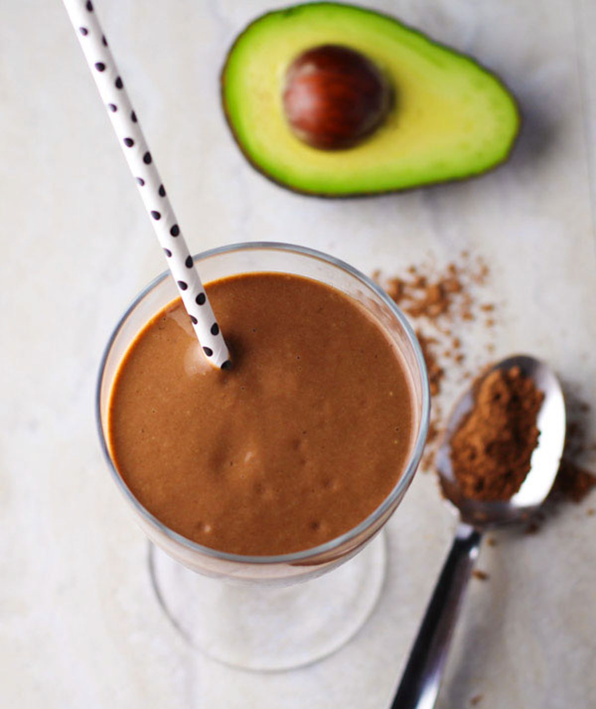 chocolate avocado smoothie with a straw