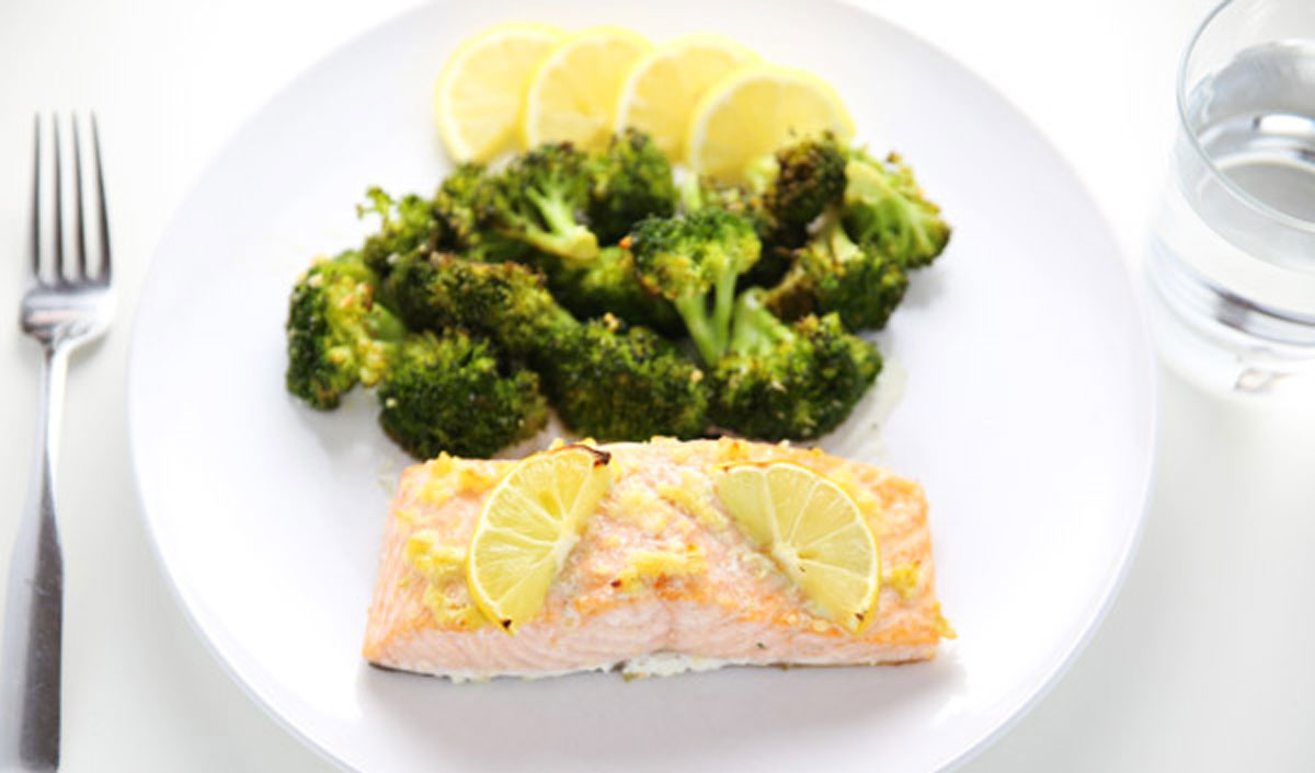 sheet pan lemon garlic salmon with broccoli on a plate