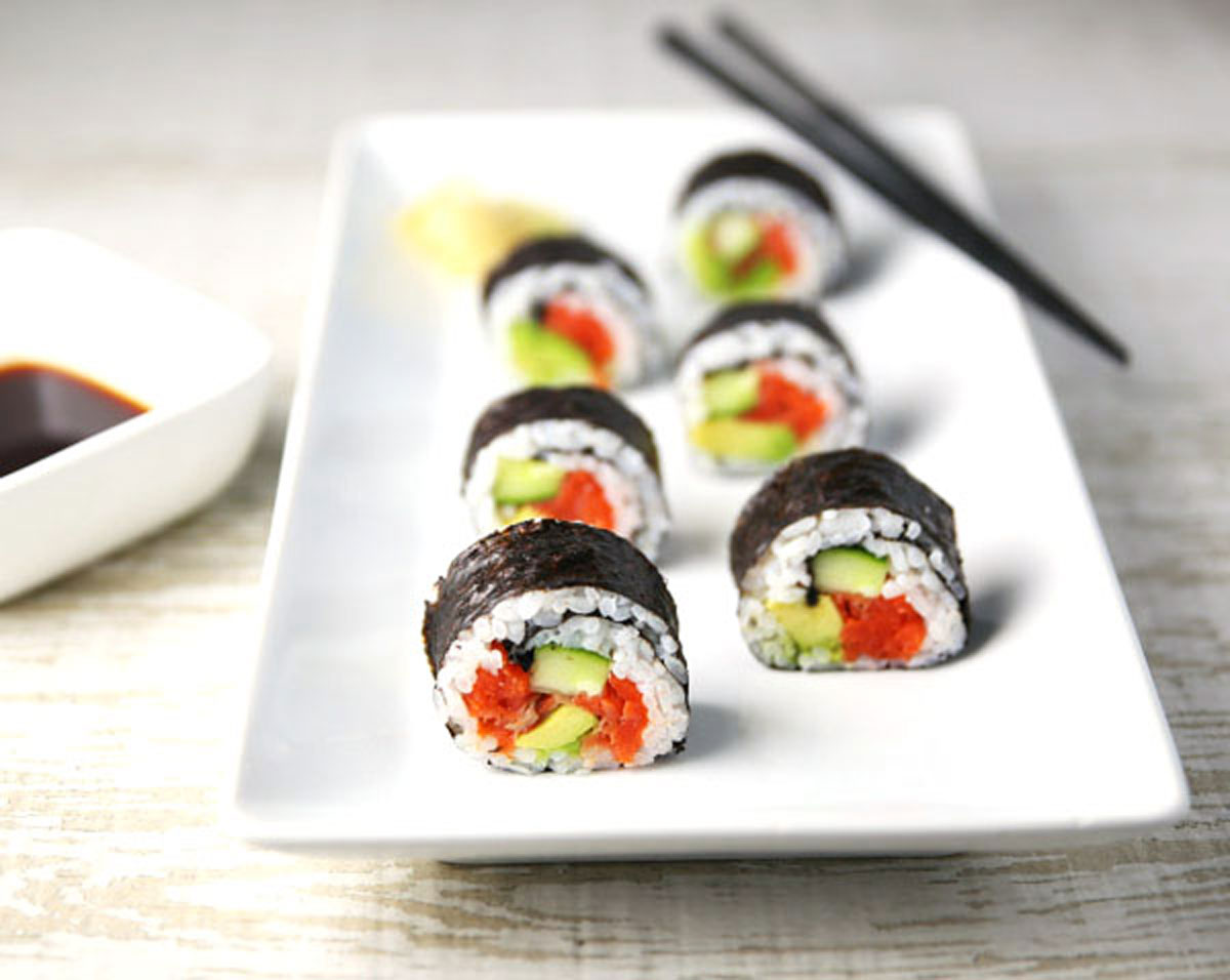 smoked salmon sushi rolls with chopsticks